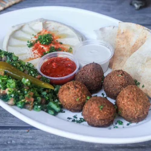 Falafel Plate - 5 falafels served with hummus, tabouli and pita bread.