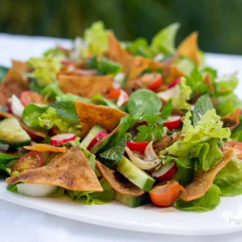 Fattoush Salad - Fresh Mediterranean salad with crispy pita chips and tangy dressing.