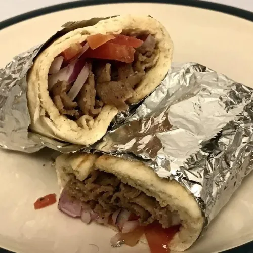 Gyro - Beef, lamb or chicken with our special tzatziki sauce on gyro bread.