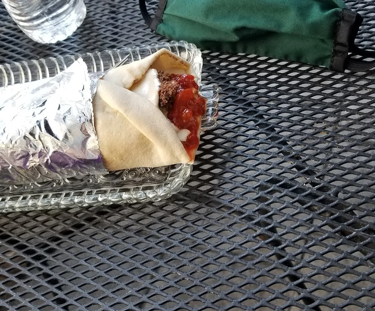 Red Falafel Sandwich - Falafel with special red tahini, salad, hummus and red shatta on pita bread.